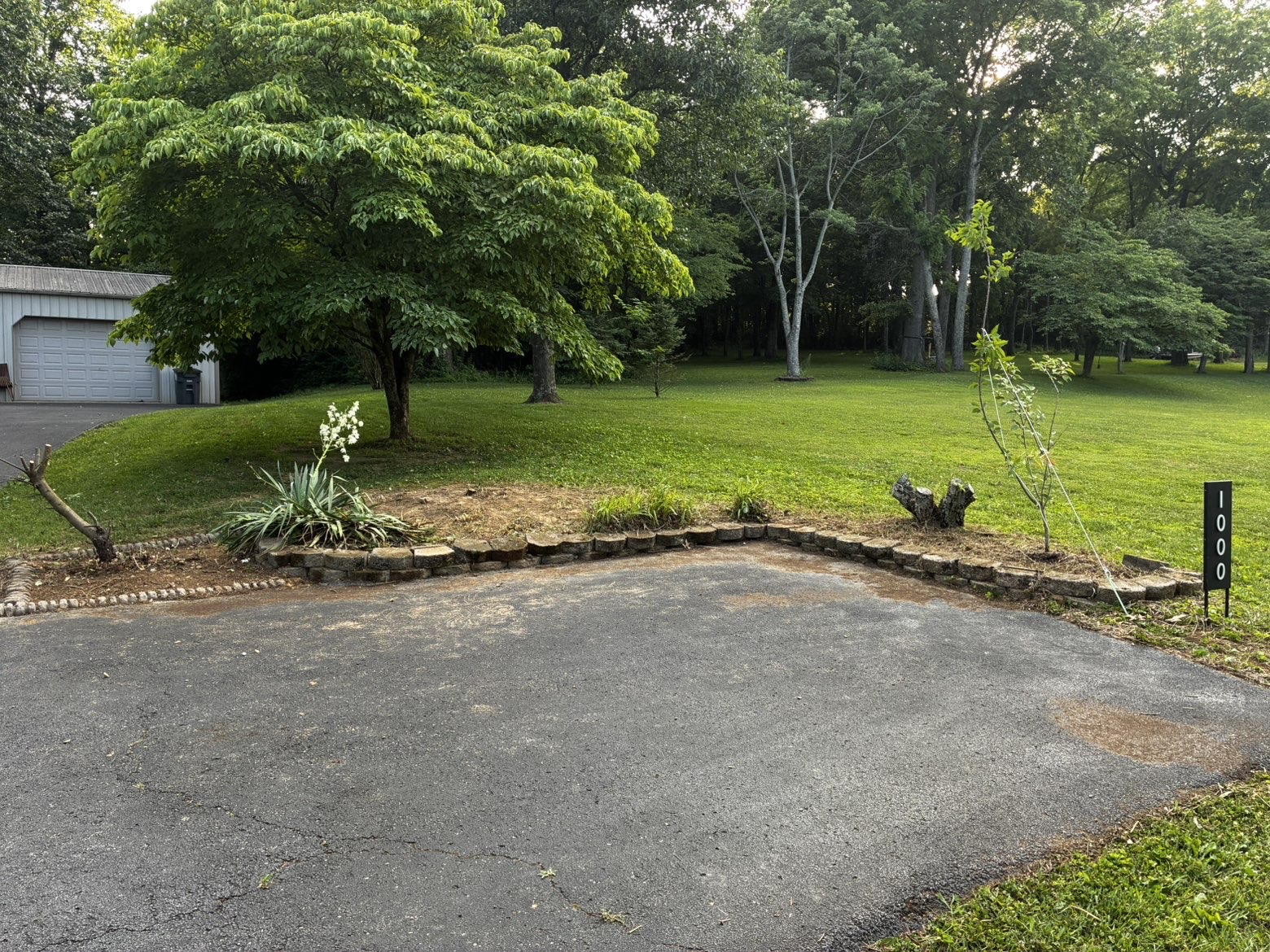 Cleared driveway with tidy stone border after ProMow